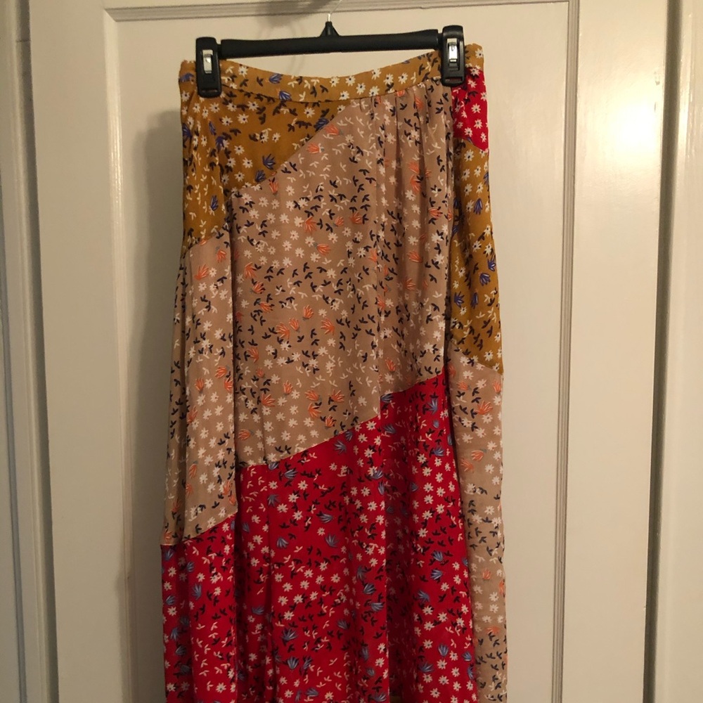 Q2 Collection multi-patterned midi skirt.